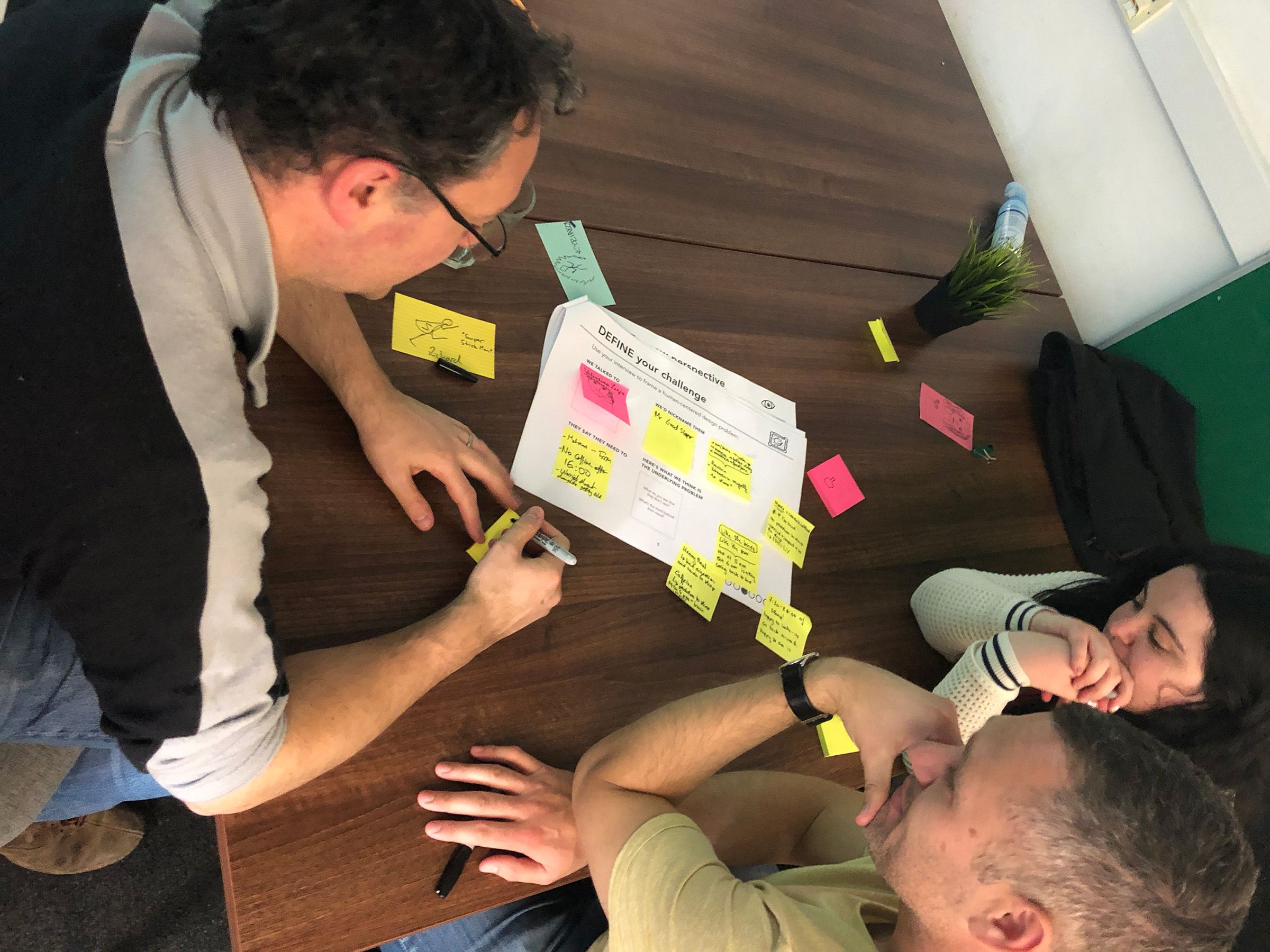 Participants at the Wimbletech Design Lab workshop collaborating around post-it notes